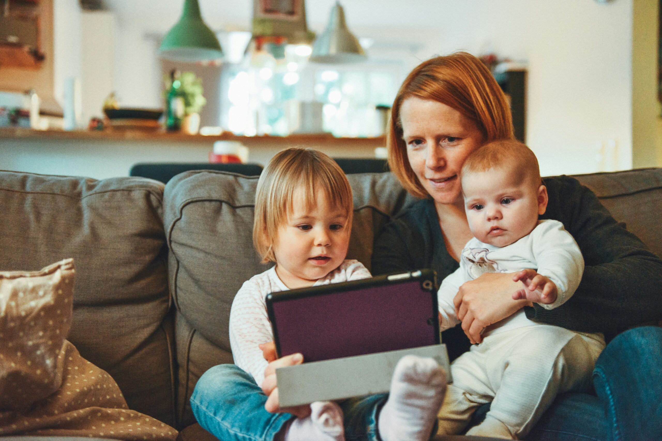Mother and children sitting together smiling